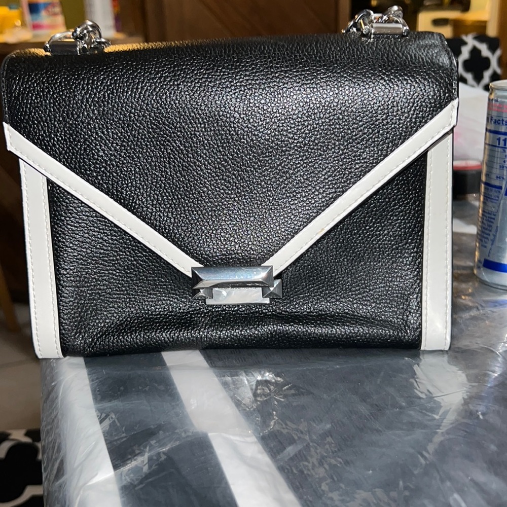 Black and white Mk purse one strap around the shoulder looks really nice